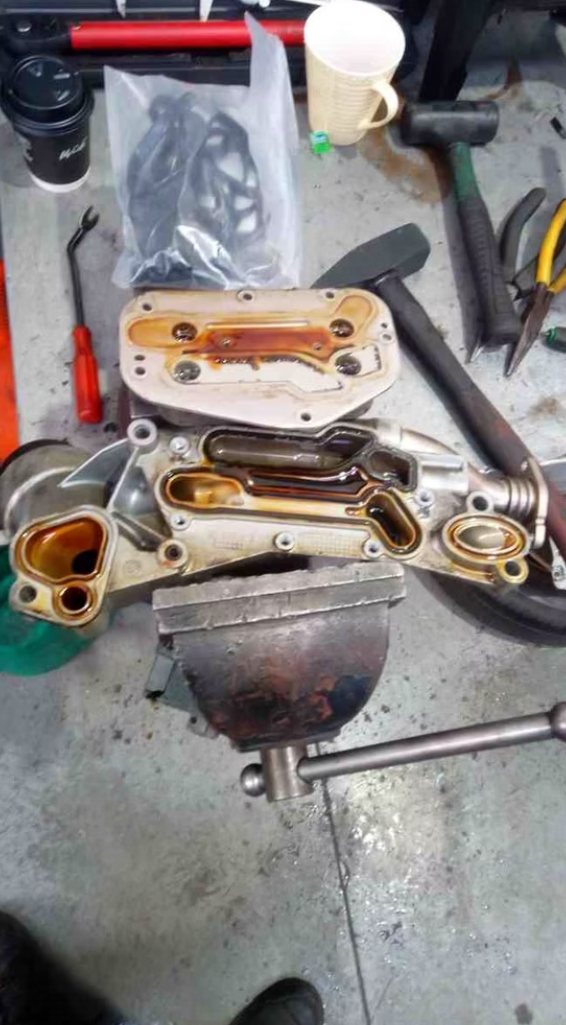 Disassembled engine component laid out on a workbench during service