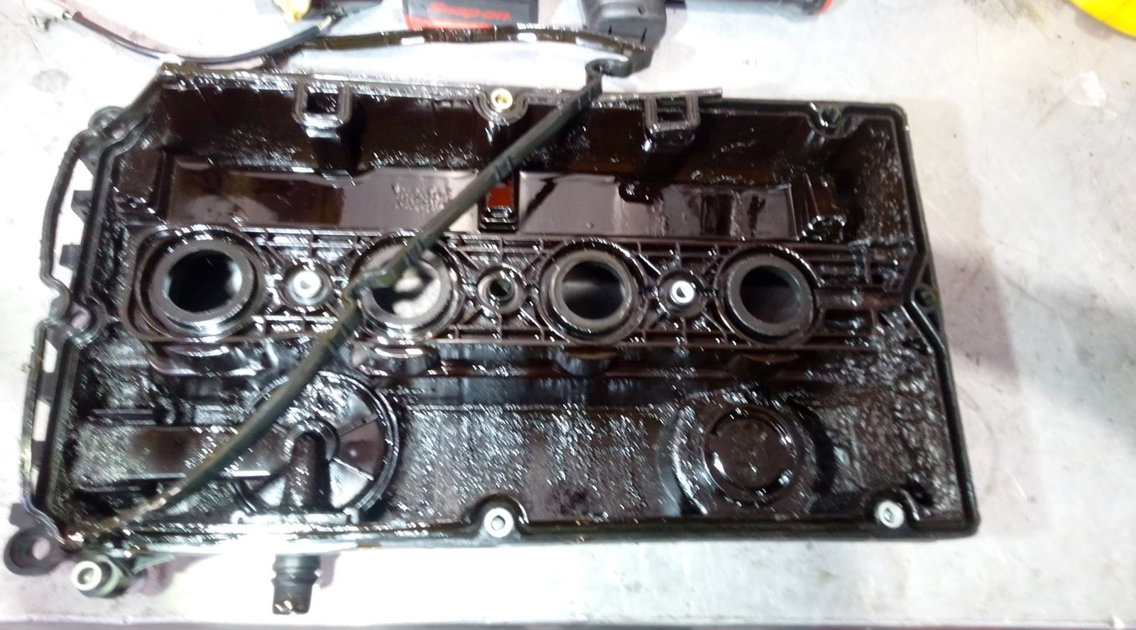 Valve cover removed and cleaned during engine service